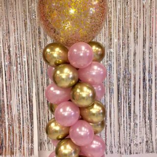 balloon column with pink confetti balloon topper