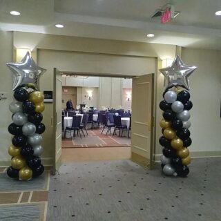 balloon column with silver star topper