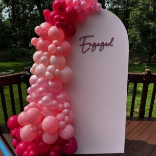 Engagement balloon garland w pink wall