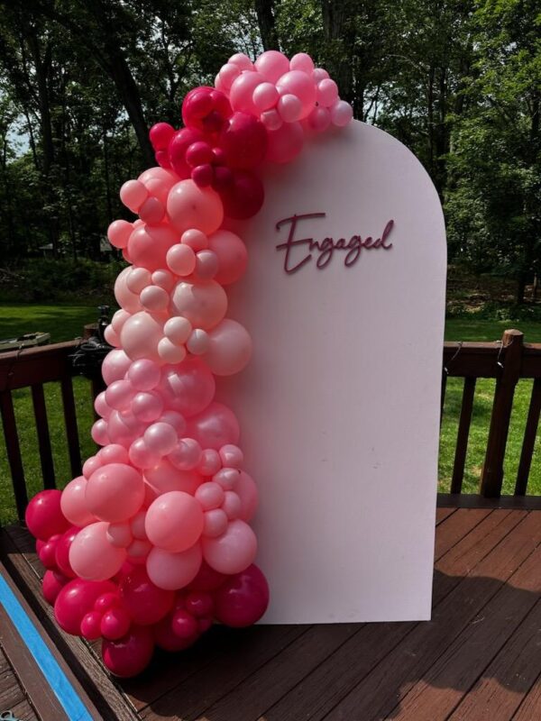 Engagement balloon garland w pink wall